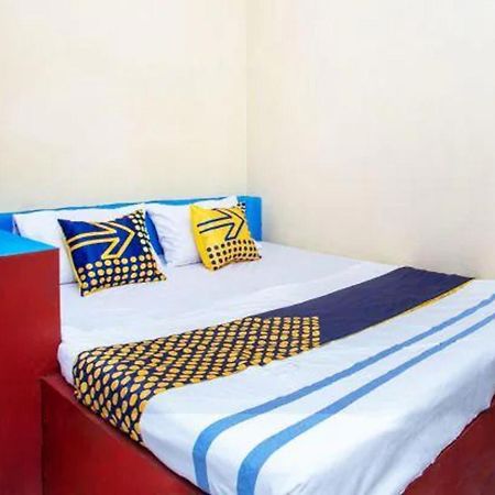 Spot On 2473 Buana Jaya Guest House سيلاكاب المظهر الخارجي الصورة
